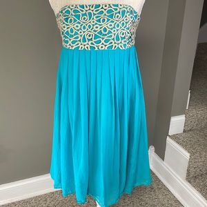 Lilly Pulitzer Aqua strapless dress. Pleated dress with gold accents on the top